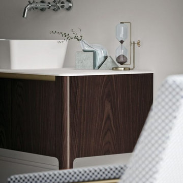 Contemporary bathroom with medium wood color and metallic features