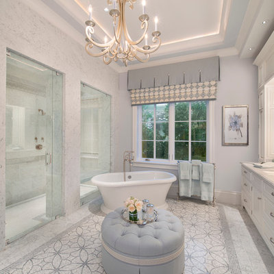 Bathroom - large traditional master white tile marble floor bathroom idea in Miami with an undermount sink, recessed-panel cabinets, white cabinets and gray walls