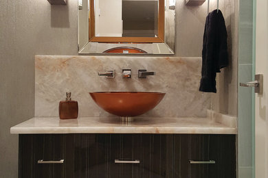 Trendy bathroom photo in Miami with flat-panel cabinets, dark wood cabinets, gray walls and a hinged shower door