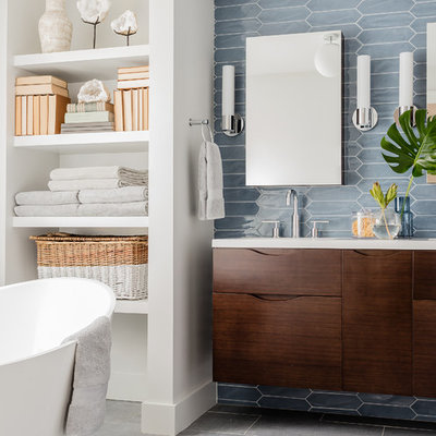 Inspiration for a contemporary master blue tile gray floor bathroom remodel in Boston with flat-panel cabinets, dark wood cabinets, white walls and an undermount sink