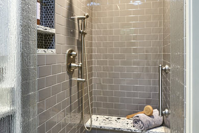 Example of a small trendy master gray tile and ceramic tile ceramic tile walk-in shower design in Other