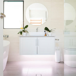 Design ideas for a contemporary bathroom in Newcastle - Maitland with shaker cabinets, white cabinets, an alcove shower, a vessel sink, grey floor and beige benchtops.