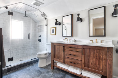 Inspiration for a mid-sized contemporary master gray tile and subway tile porcelain tile and black floor doorless shower remodel in New York with shaker cabinets, dark wood cabinets, a two-piece toilet, gray walls, an undermount sink, quartz countertops, a hinged shower door and white countertops