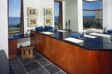 Example of a large trendy master bathroom design in Orange County with flat-panel cabinets, red cabinets, quartzite countertops and black countertops