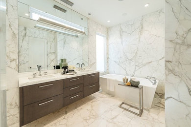 Bathroom - large contemporary master gray tile, white tile and stone slab marble floor and white floor bathroom idea in San Francisco with white walls, an undermount sink, flat-panel cabinets, medium tone wood cabinets, marble countertops and a hinged shower door