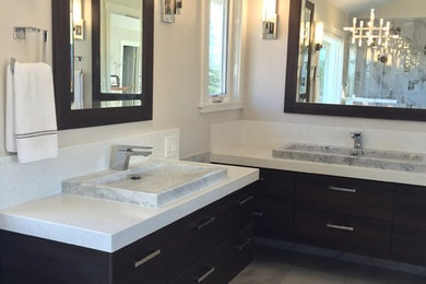 Example of a trendy white tile and porcelain tile porcelain tile bathroom design in San Francisco with flat-panel cabinets, dark wood cabinets, a one-piece toilet, gray walls and quartz countertops