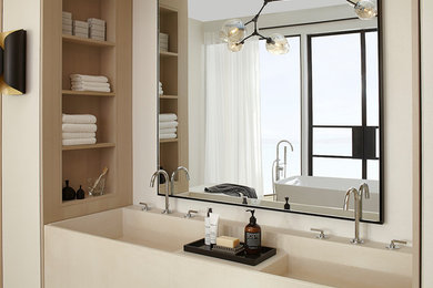 Example of a mid-sized trendy master light wood floor bathroom design in Miami with flat-panel cabinets, light wood cabinets, a bidet, white walls, an integrated sink and concrete countertops