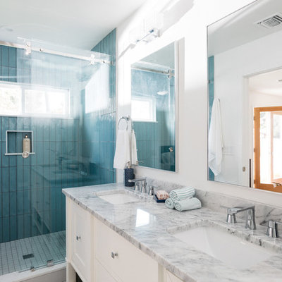 Open shower - transitional blue tile and porcelain tile open shower idea in Los Angeles with recessed-panel cabinets, white cabinets, white walls, an undermount sink, marble countertops and multicolored countertops