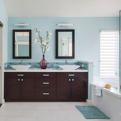 Example of a mid-sized trendy master blue tile and glass tile porcelain tile and white floor bathroom design in Los Angeles with flat-panel cabinets, dark wood cabinets, blue walls, a vessel sink, a hinged shower door and quartz countertops