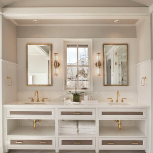 Beach style marble floor bathroom photo in New York with recessed-panel cabinets