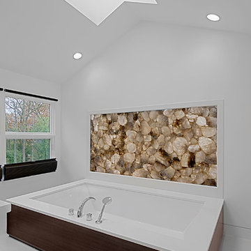 Contemporary white bathroom with skylight