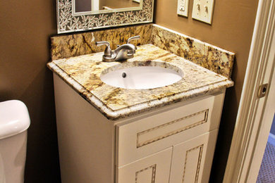 Elegant bathroom photo in Other with an undermount sink and granite countertops