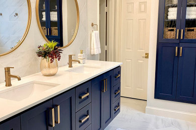 Inspiration for a mid-sized contemporary master gray tile and porcelain tile porcelain tile, gray floor and double-sink bathroom remodel in Dallas with shaker cabinets, blue cabinets, a one-piece toilet, gray walls, an undermount sink, quartz countertops, white countertops and a floating vanity