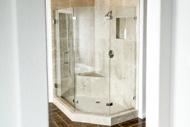 Inspiration for a large 3/4 beige tile corner shower remodel in Austin with a hinged shower door