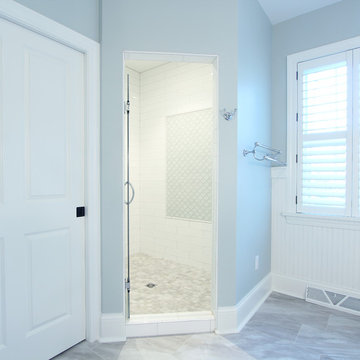 Corner Shower with Accent Tile in Coastal Master Bathroom