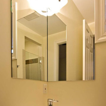 Corner Sink and Corner Mirror in small bathroom