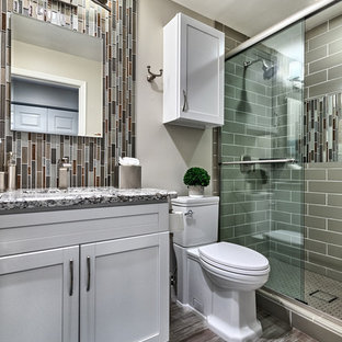 Inspiration for a small transitional 3/4 gray tile and matchstick tile porcelain tile and gray floor bathroom remodel in Phoenix with white cabinets, a two-piece toilet, gray walls, granite countertops, shaker cabinets, an undermount sink and gray countertops