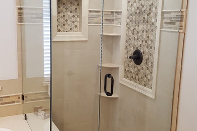 Inspiration for a mid-sized modern master beige tile travertine floor corner shower remodel in Orange County with shaker cabinets, dark wood cabinets, an undermount tub, a one-piece toilet, beige walls and quartz countertops