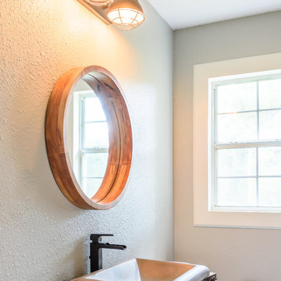 Bathroom - small rustic 3/4 dark wood floor and brown floor bathroom idea in Dallas with a two-piece toilet, gray walls, a drop-in sink, wood countertops and brown countertops