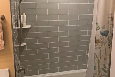 Inspiration for a small transitional kids' gray tile and ceramic tile porcelain tile, gray floor and single-sink bathroom remodel in Baltimore with shaker cabinets, blue cabinets, a two-piece toilet, beige walls, an undermount sink, quartz countertops, beige countertops and a built-in vanity