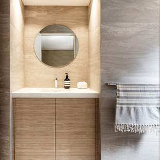 This is an example of a large contemporary 3/4 bathroom in Sydney with light wood cabinets, gray tile, porcelain tile, porcelain floors, an undermount sink, engineered quartz benchtops, grey floor, white benchtops and flat-panel cabinets.