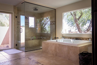 Inspiration for a large contemporary master brown tile and travertine tile travertine floor and brown floor bathroom remodel in Phoenix with recessed-panel cabinets, black cabinets, brown walls, a vessel sink, granite countertops, a hinged shower door and brown countertops