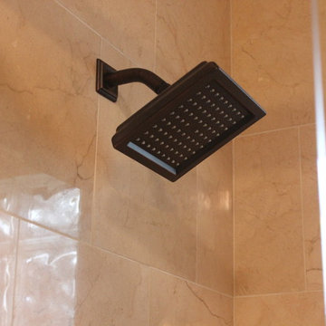 Crema Marfil Marble Shower w/Frameless Glass Slider and Java Cherry Cabinets