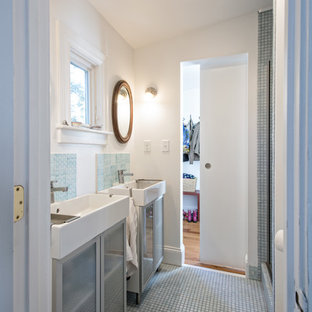 Inspiration for a small traditional ensuite bathroom in Louisville with a console sink, glass-front cabinets, blue tiles, ceramic tiles, white walls and mosaic tile flooring.