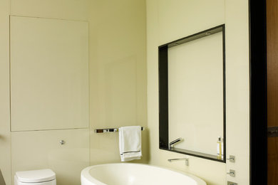 Photo of a medium sized classic ensuite bathroom in London with beige walls, marble flooring and brown floors.