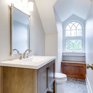 Bathroom - traditional mosaic tile floor and gray floor bathroom idea in Minneapolis with shaker cabinets, medium tone wood cabinets, white walls and a console sink