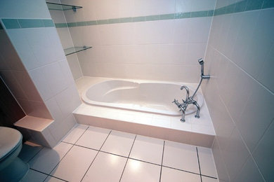 Bathroom in Kent with white tiles.