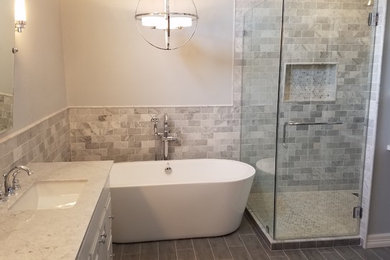 Example of a mid-sized trendy master gray tile, multicolored tile, white tile and marble tile ceramic tile and gray floor bathroom design in Houston with raised-panel cabinets, white cabinets, multicolored walls, an undermount sink, marble countertops and a hinged shower door