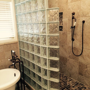 Curved glass block shower with thinner glass blocks and a ready for tile base