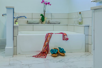 Example of a large minimalist master blue tile and cement tile cement tile floor, multicolored floor and double-sink bathroom design in Nashville with flat-panel cabinets, white cabinets, a one-piece toilet, blue walls, an undermount sink, quartzite countertops, a hinged shower door, multicolored countertops and a freestanding vanity