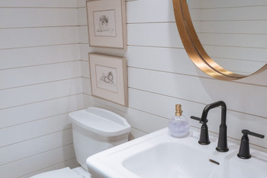 Bathroom - 1950s shiplap wall bathroom idea in Vancouver with white walls and a pedestal sink