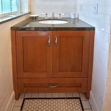 Custom built-in white oak vanity with granite countertop