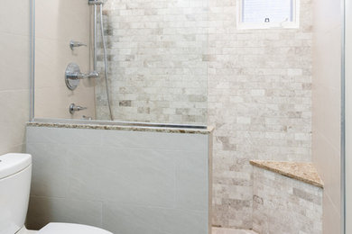 Inspiration for a mid-sized transitional master multicolored tile and stone tile porcelain tile alcove shower remodel in Ottawa with an undermount sink, shaker cabinets, gray cabinets, quartz countertops and a two-piece toilet