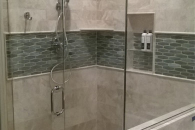 Example of a mid-sized transitional gray tile and mosaic tile ceramic tile corner shower design in Minneapolis