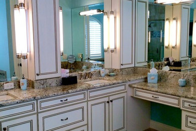 Bathroom - mid-sized transitional master beige tile and porcelain tile porcelain tile bathroom idea in Miami with an undermount sink, recessed-panel cabinets, white cabinets, granite countertops and blue walls