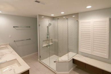 Inspiration for a mid-sized contemporary master gray tile and porcelain tile porcelain tile and white floor bathroom remodel in Baltimore with furniture-like cabinets, gray cabinets, a two-piece toilet, blue walls, an undermount sink, quartz countertops and a hinged shower door