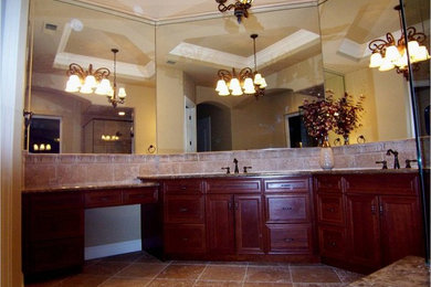 Example of a large classic master beige tile and stone tile travertine floor bathroom design in Other with beaded inset cabinets, dark wood cabinets, beige walls, an undermount sink and granite countertops