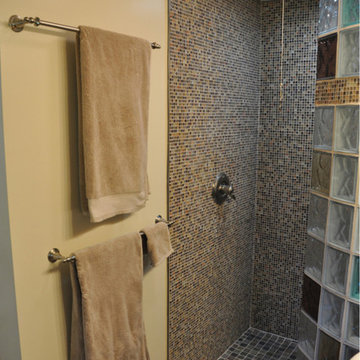 Custom shower base for a curved walk in glass block wall New York