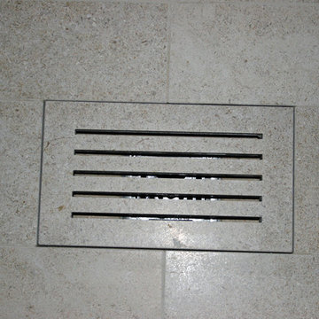 Custom stone tile shower drain