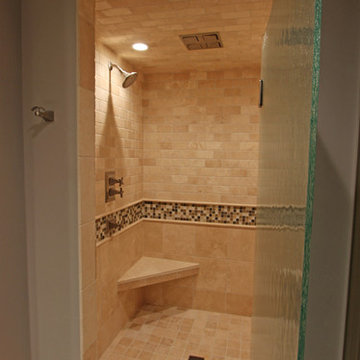 Custom Tile Shower with Corner Tile Bench and Textured Glass Door