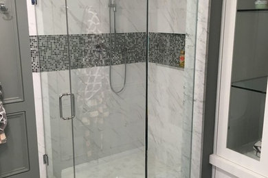 Example of a large trendy master white tile and stone tile alcove shower design in New York with white walls, shaker cabinets, white cabinets and an undermount sink
