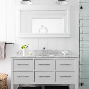 Design ideas for a country bathroom in Brisbane with furniture-like cabinets, white cabinets, a curbless shower, white tile, subway tile, white walls, an undermount sink, multi-coloured floor and white benchtops.