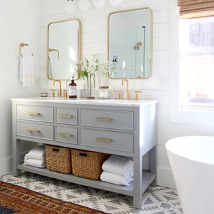 Example of a cottage chic master multicolored floor, double-sink and shiplap wall freestanding bathtub design in Atlanta with gray cabinets, white walls, white countertops and a freestanding vanity