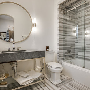 Example of a tuscan bathroom design in Dallas with a two-piece toilet, white walls, open cabinets and gray countertops