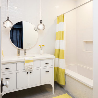 Inspiration for a transitional white tile gray floor alcove bathtub remodel in Los Angeles with an undermount sink, flat-panel cabinets and white cabinets