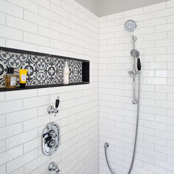 Dark grey-floored wetroom with encaustic flooring and freestanding bath - Hove